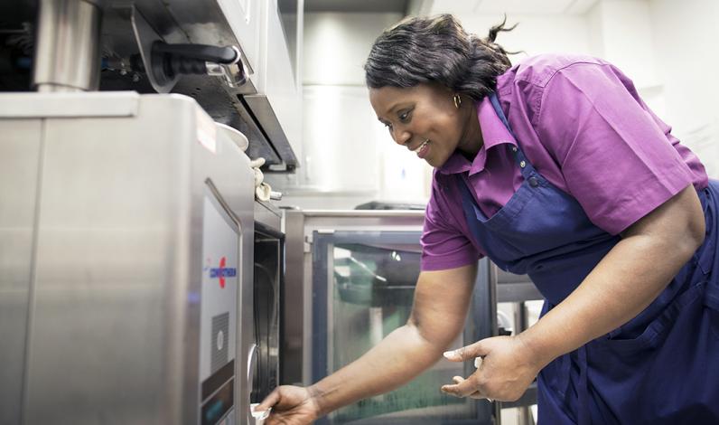Ward Hostess Gifty Brobbey preparing food