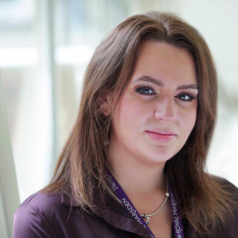 Trial Manager Amy O'Reilly, a young white woman with long brown hair