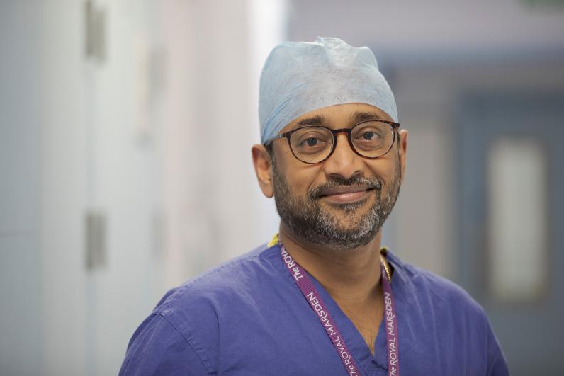 Professor Vinidh Paleri wearing scrubs